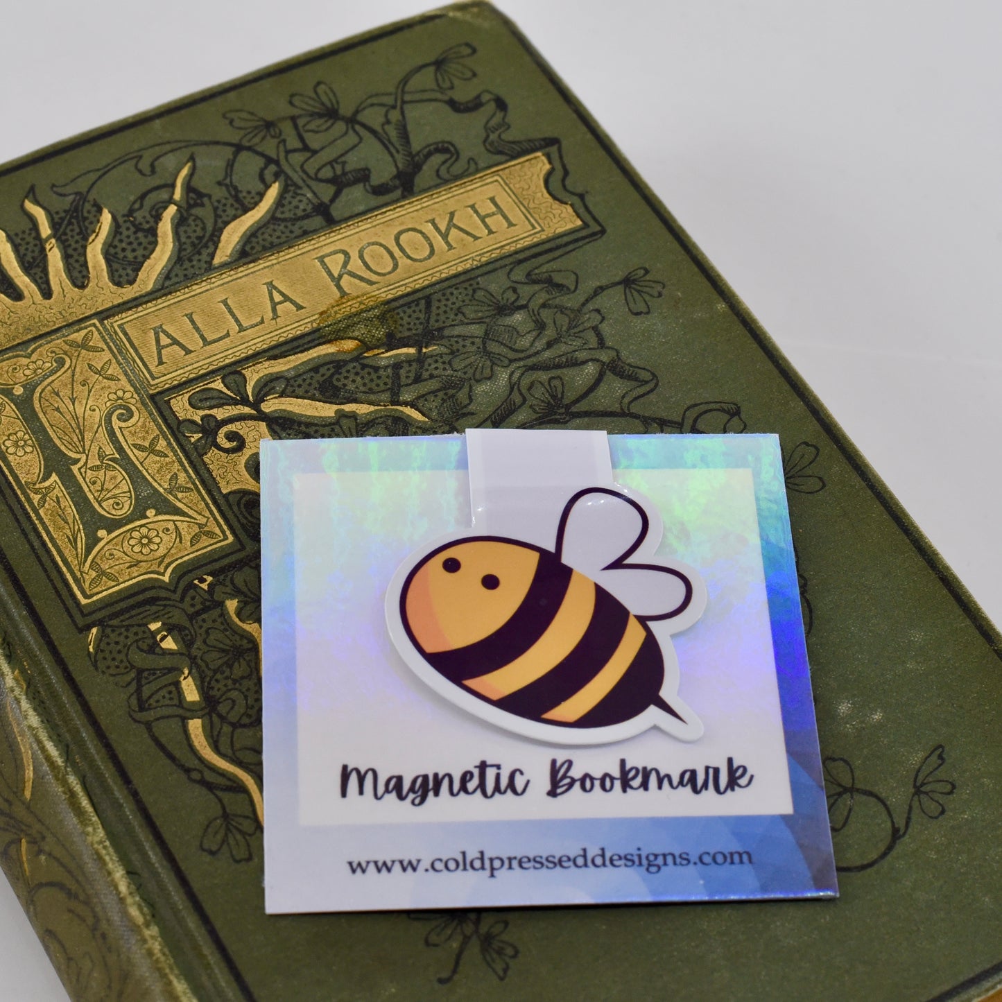 A handmade magnetic bookmark with a bumble bee design.