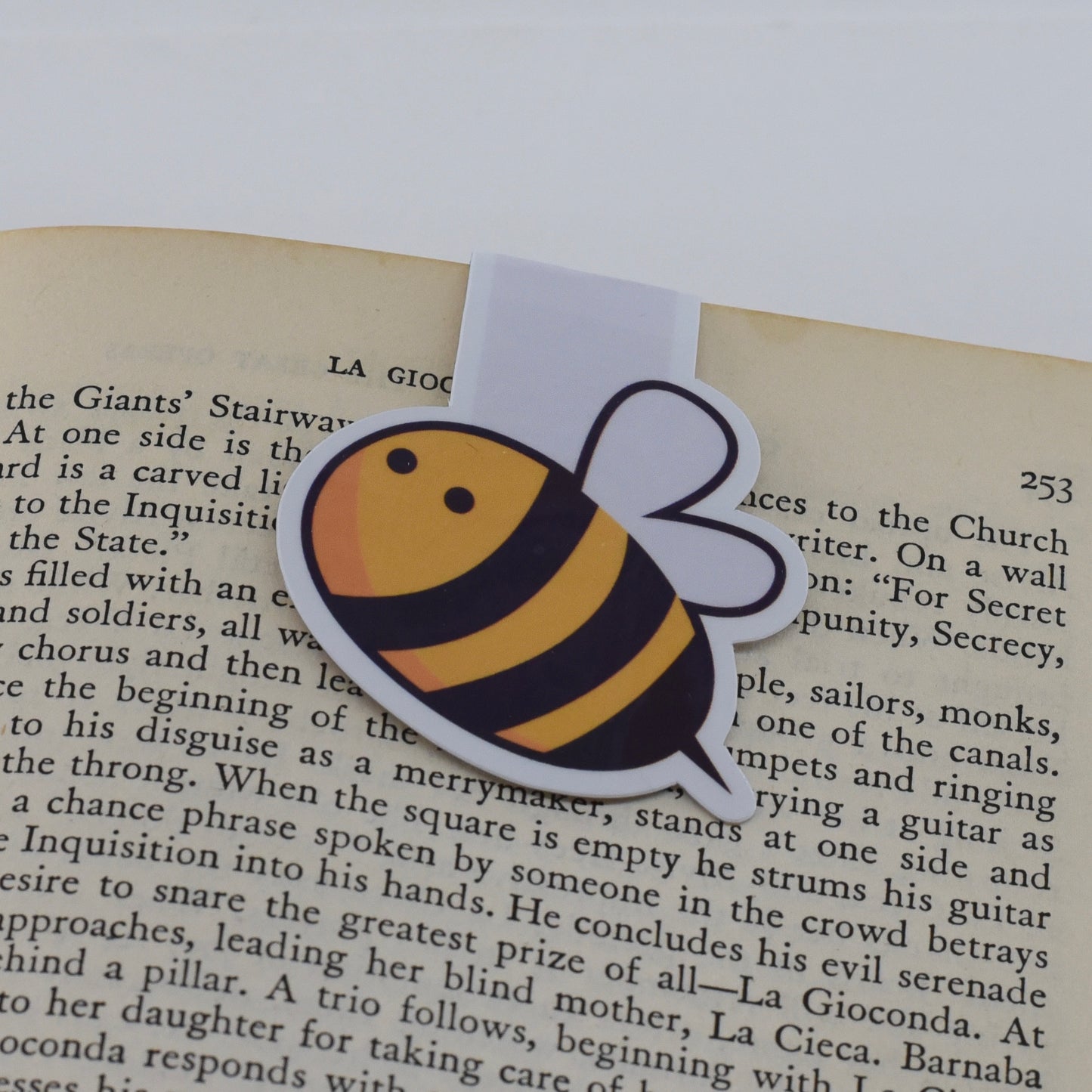 A handmade magnetic bookmark with a bumble bee design.