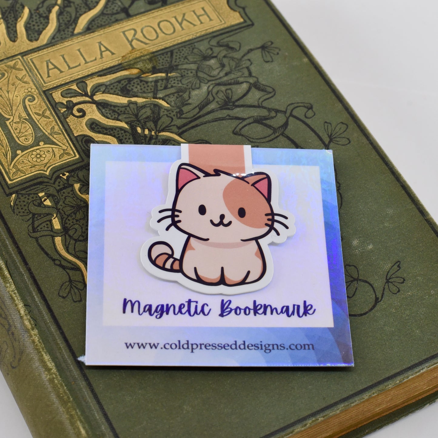 A handmade magnetic bookmark featuring a cartoon image of a happy cat on a glossy background.