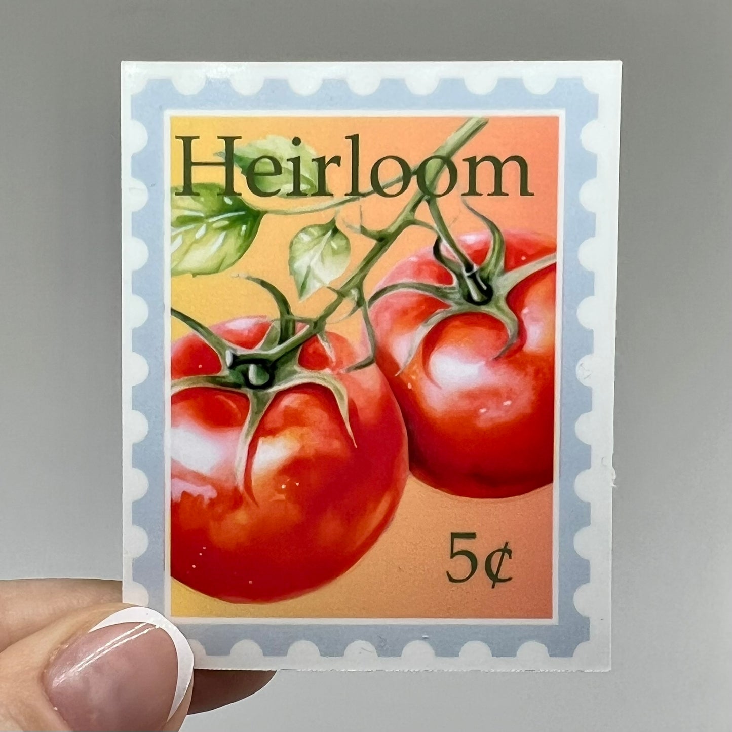 A vinyl sticker with an image of heirloom tomatoes and the price '5 cents' on a postage stamp style background.