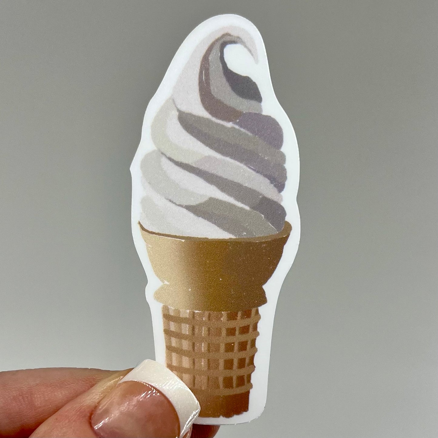 A vinyl sticker depicting a vanilla soft serve ice cream cone.