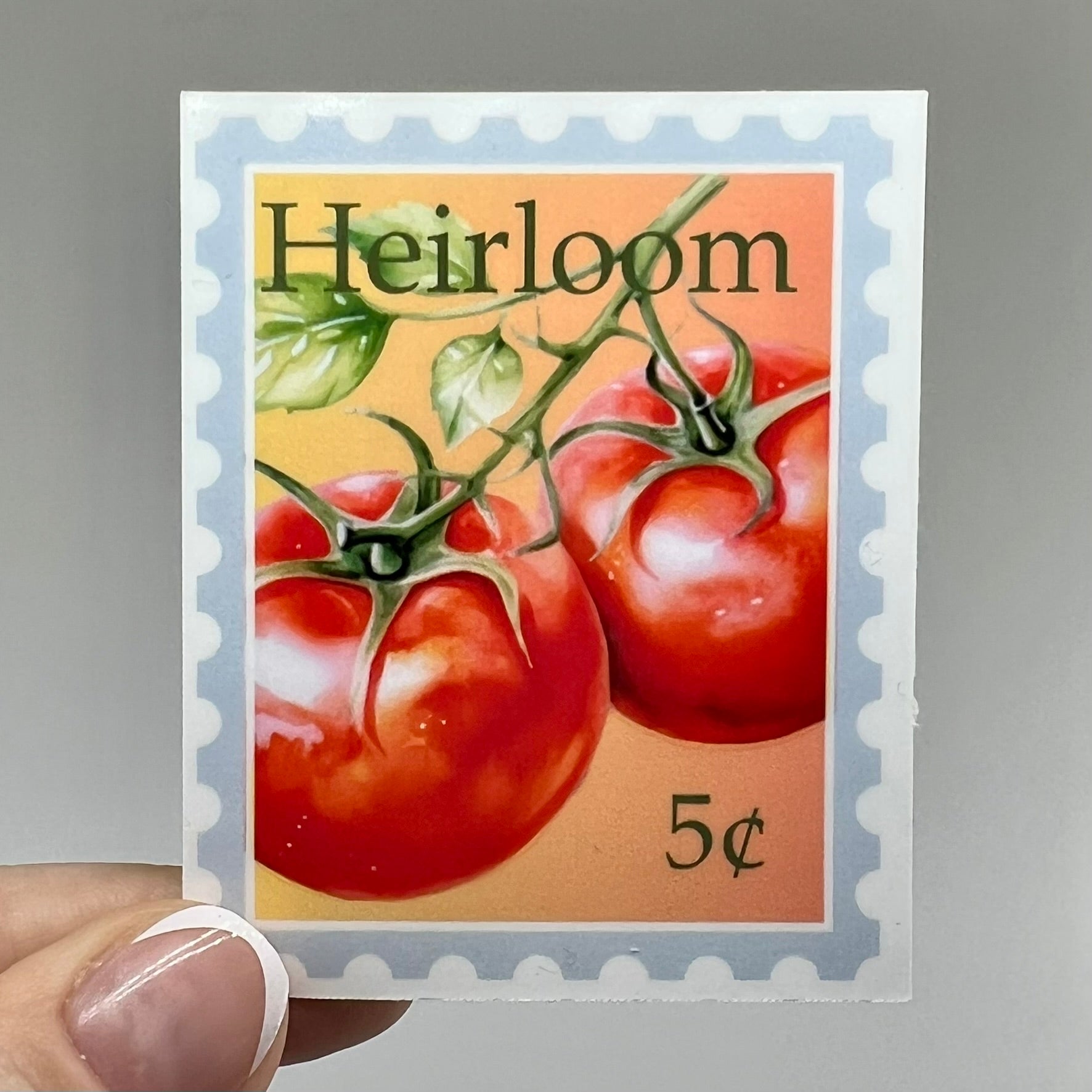 A vinyl sticker with an image of heirloom tomatoes and the price '5 cents' on a postage stamp style background.