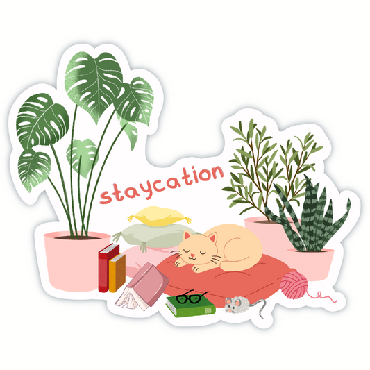 Sticker with a cat, books, plants, and yarn on a white background with 'staycation' text.