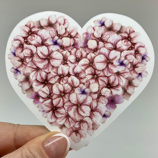 Pink hydrangea flower petals in a sticker vinyl shaped like a heart.