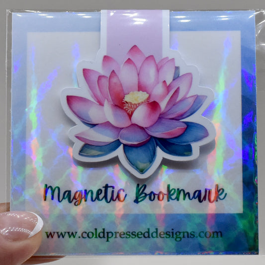 A closed glossy magnetic bookmark with an open pink lotus flower design.