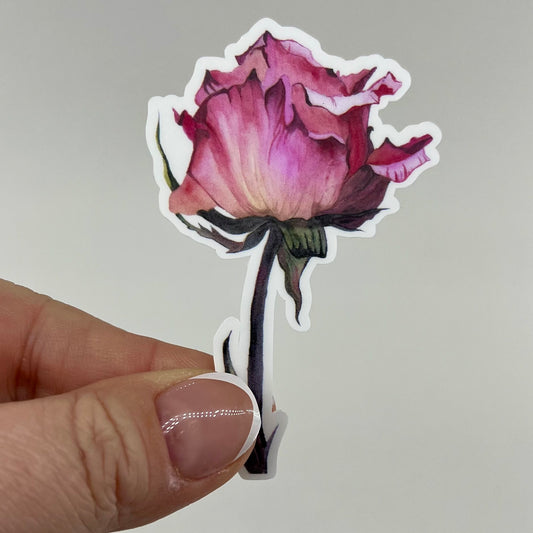 A vinyl sticker of a red watercolor rose with a green stem.